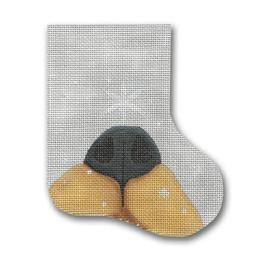 A Christmas stocking with a black and yellow dog on it, designed by Cecilia.