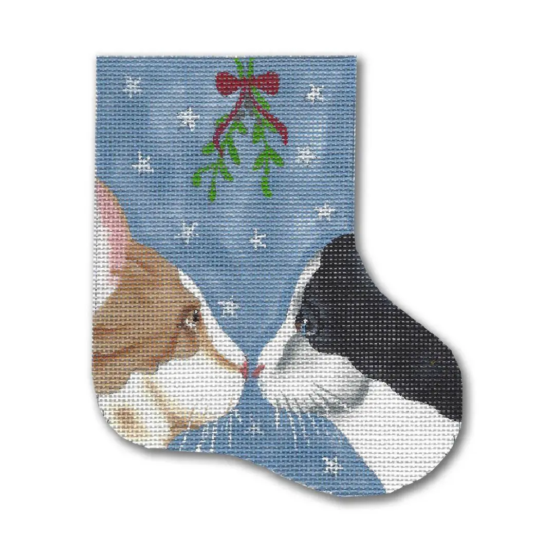 Two cats, Cecilia and Ohm, are kissing on a Christmas stocking.