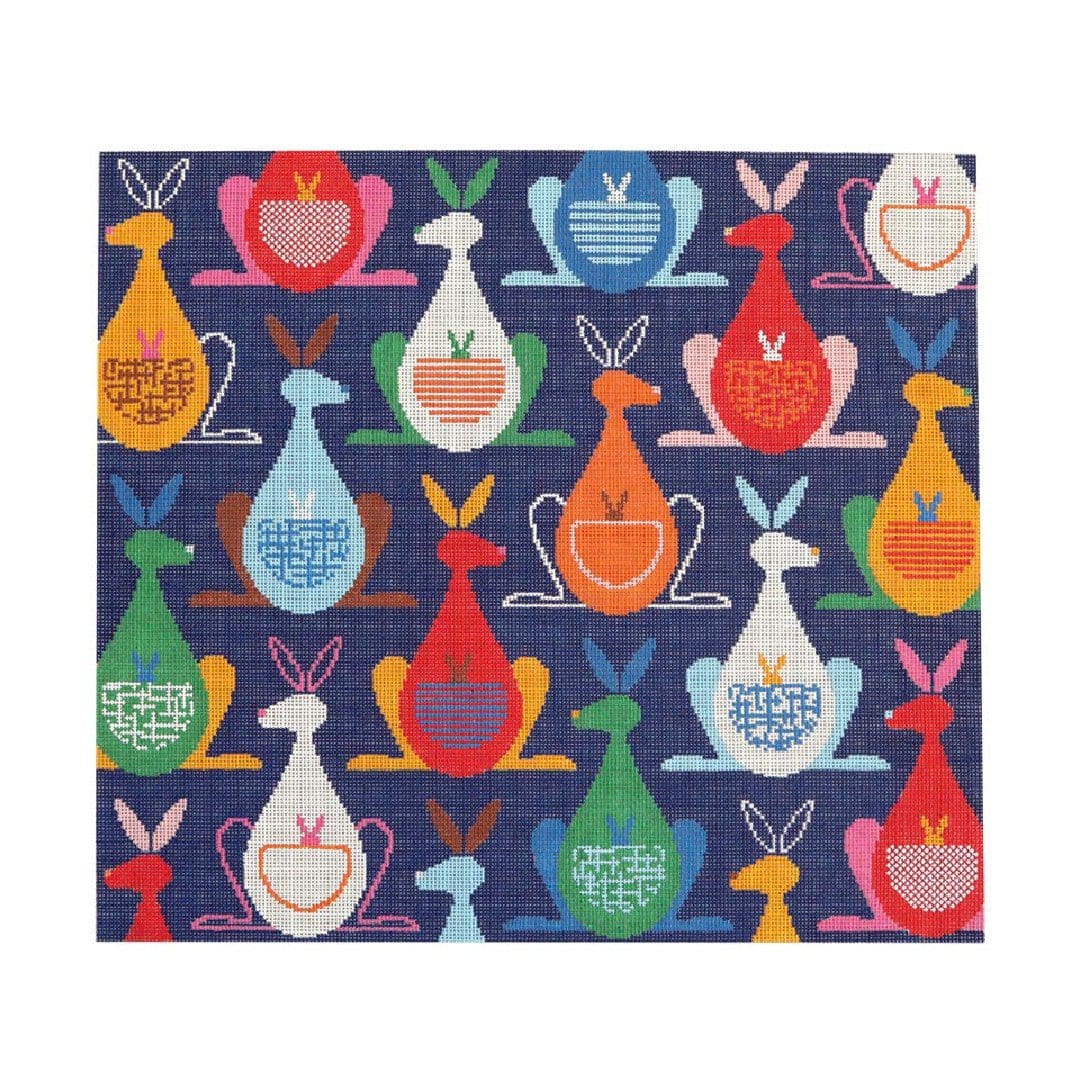 A blue fabric with colorful rabbits on it, designed by Cecilia Ohm.