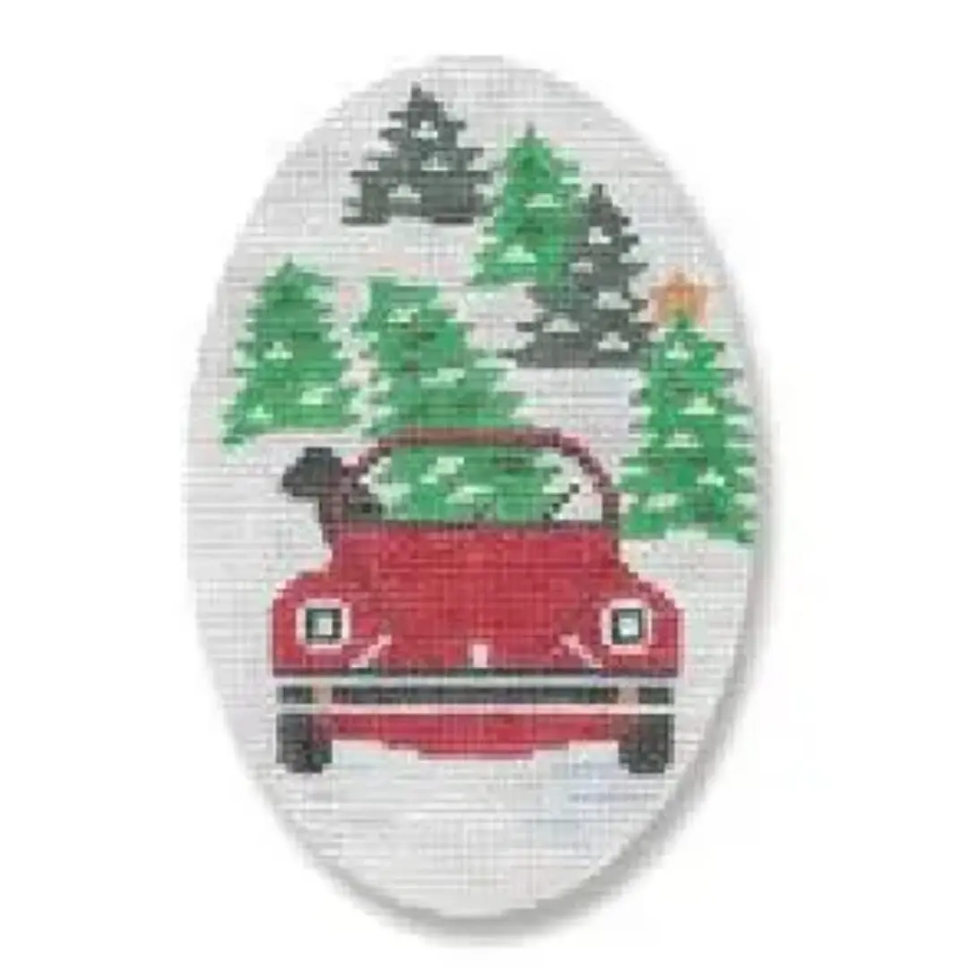Cecilia Ohm Eriksen's incredible cross stitch masterpiece showcases a stunning red car with the serene backdrop of trees.