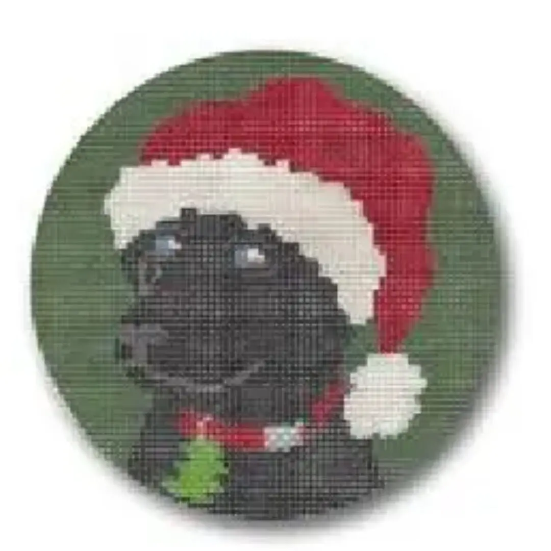 A black labrador wearing a santa hat, named Cecilia.
