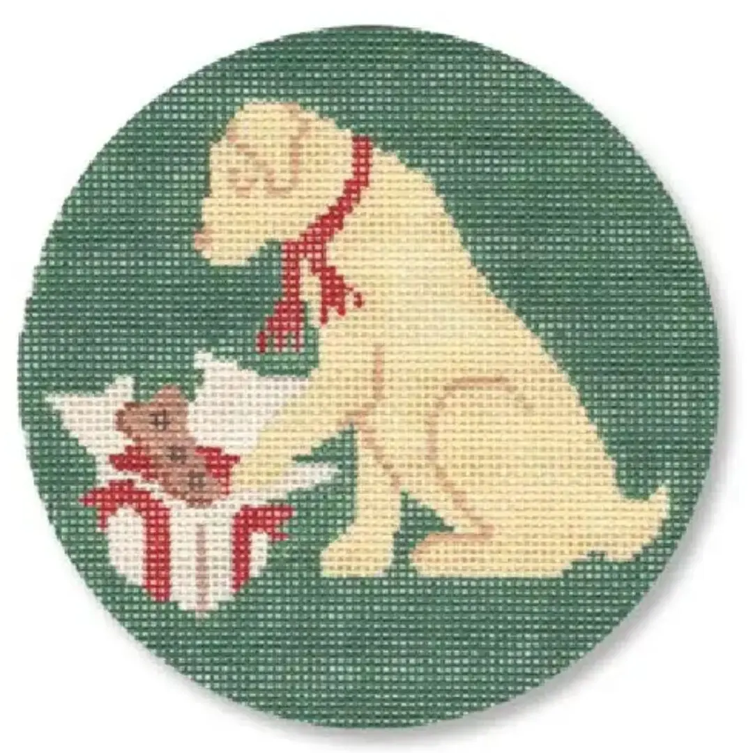 A cross stitch picture of a dog with a teddy bear designed by Cecilia Ohm Eriksen.