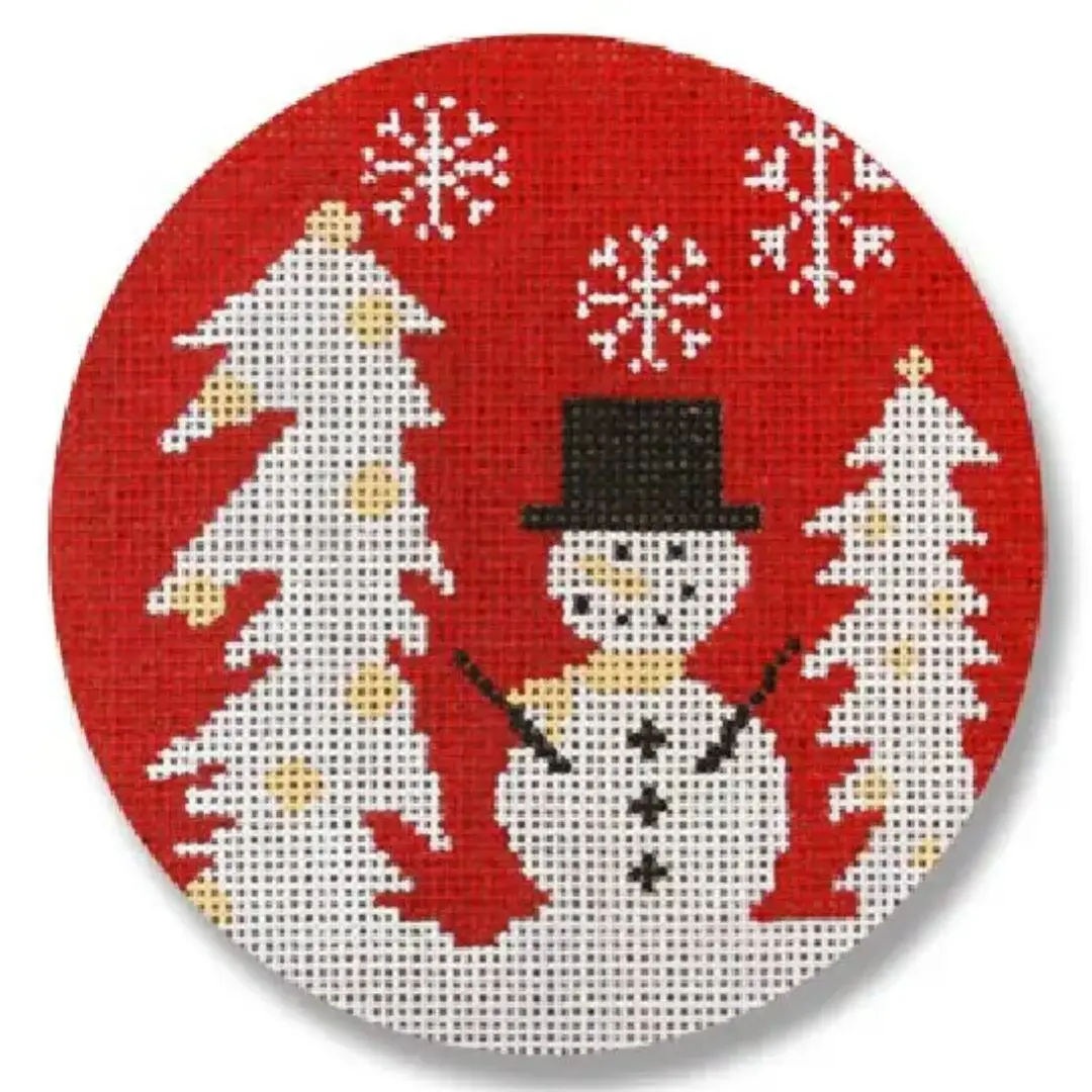 A cross stitch pattern of a snowman in a top hat designed by Cecilia Ohm Eriksen.