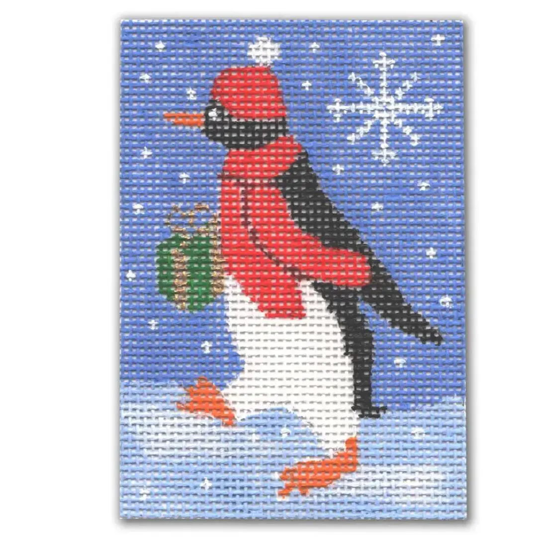 A cross stitch pattern of a penguin holding a gift, designed by Cecilia Ohm.