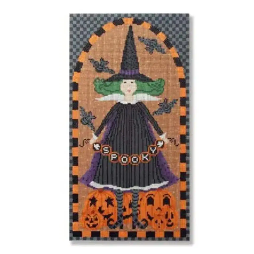 A black and white picture of a witch with pumpkins and a witch's hat, featuring Cecilia Eriksen.