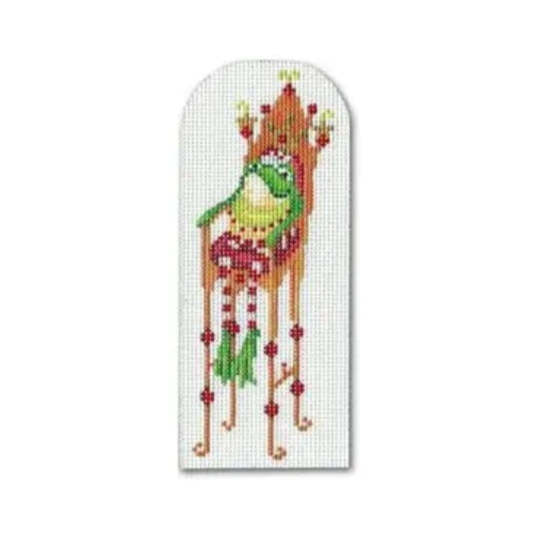 A cross stitch pattern of a frog on a chair by Cecilia.