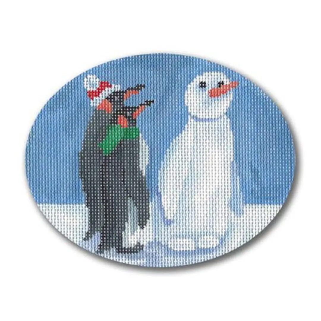 A cross stitch picture of a penguin wearing a Santa hat.