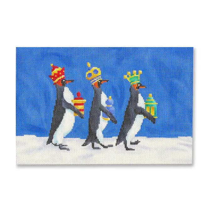 Three penguins with crowns walking in the snow.