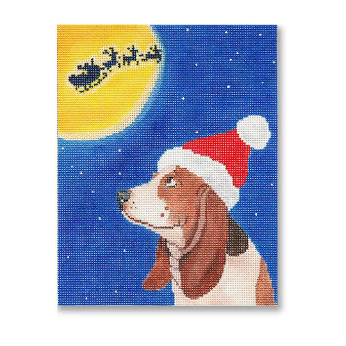 A painting of a basset hound with a santa hat.
