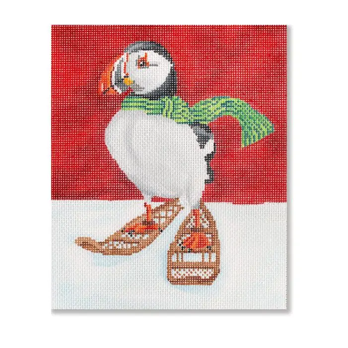 A painting of a puffin on a pair of sleds.