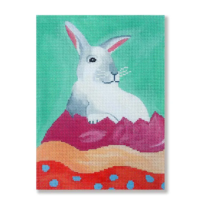 A painting of a white bunny on a green background.