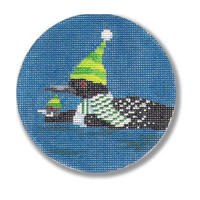 A cross stitch picture of a loon with a santa hat.