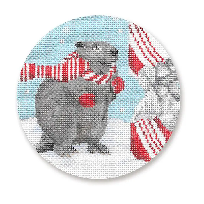 A cross stitch picture of a santa claus and a beaver.
