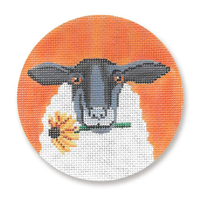 A cross stitch picture of a sheep holding a sunflower.