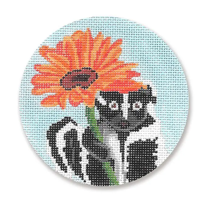 A cross stitch picture of a skunk with a flower.