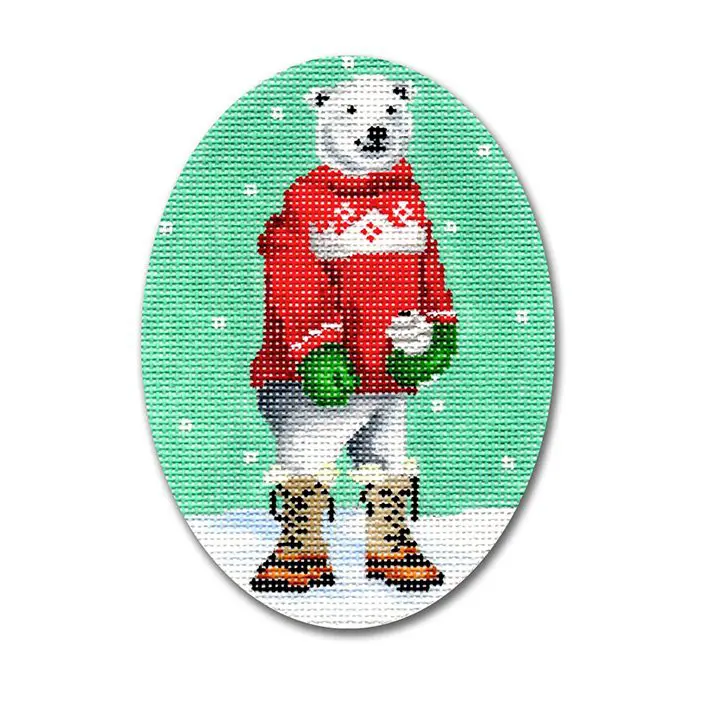 A cross stitch picture of a polar bear in a red sweater.