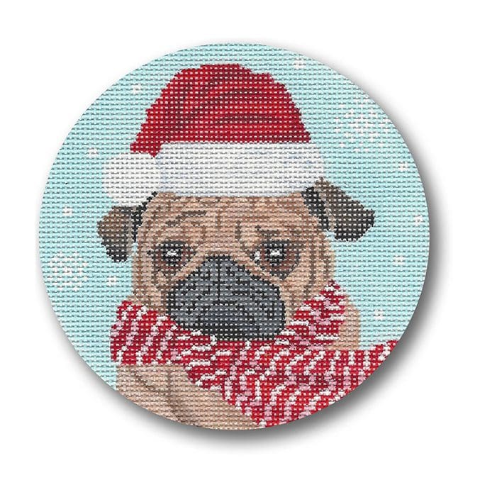 A pug wearing a santa hat and scarf on a round needlepoint canvas.