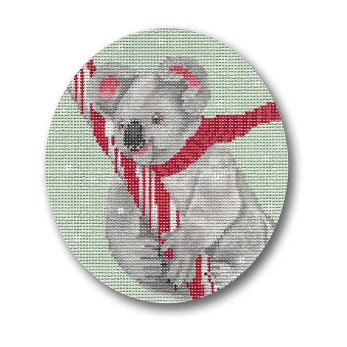 A koala holding a candy cane on a round canvas.