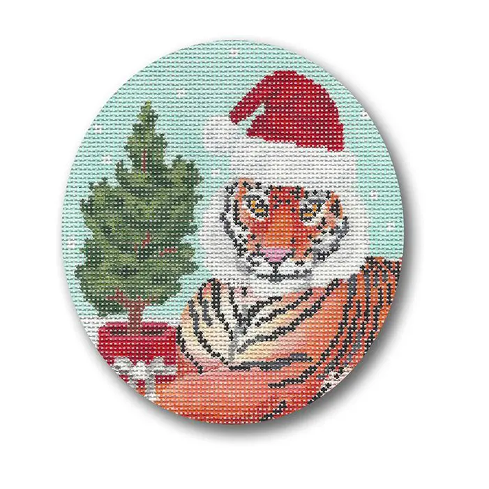 A tiger in a santa hat with a christmas tree.