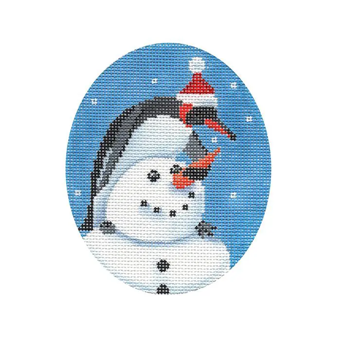 A cross stitch picture of a penguin with a santa hat.