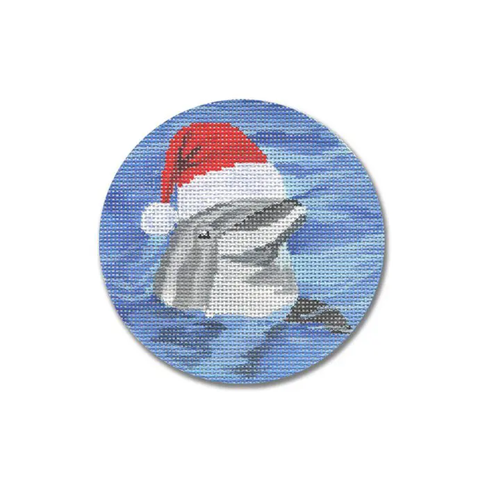 A cross stitch picture of a dolphin wearing a santa hat.