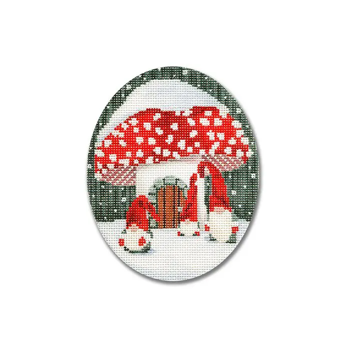 A cross stitch picture of a mushroom and a santa hat.