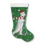 A christmas stocking with a polar bear riding a scooter.
