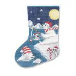 A cross stitch stocking with polar bears on it.