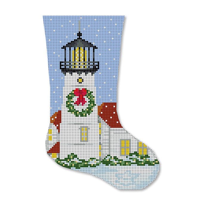 A Christmas stocking with a lighthouse on it featuring Cecilia Ohm Eriksen.