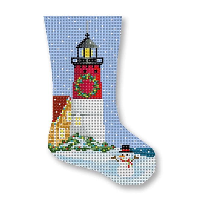 A Christmas stocking featuring a snowman and lighthouse, designed by Cecilia Ohm Eriksen.