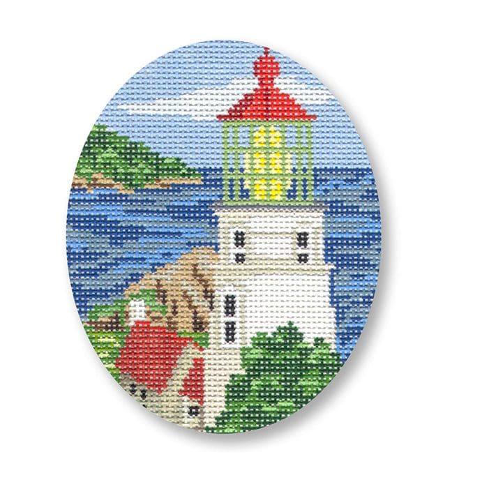 An intricately cross stitched picture of a lighthouse, crafted by Cecilia.
