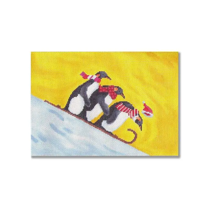 A painting of penguins on a sled by Cecilia Ohm.