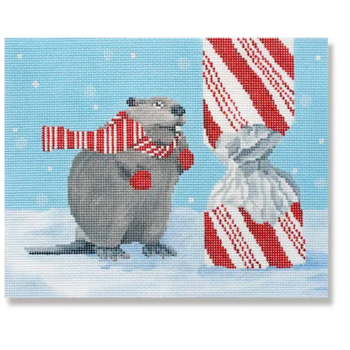 Cecilia, a beaver, wearing a scarf and holding a candy cane.