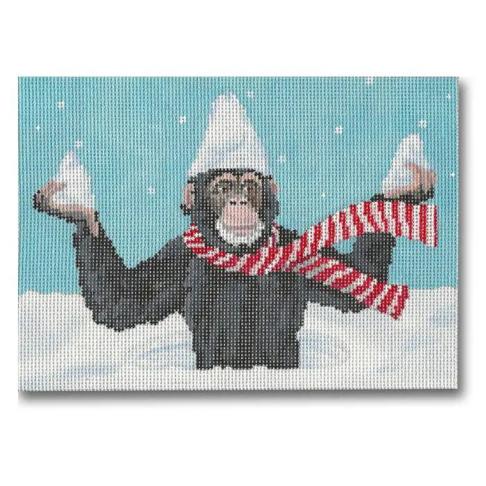 Cecilia, a chimpanzee, wearing a hat in the snow.