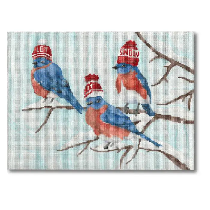 Three bluebirds wearing hats on a branch in the snow.