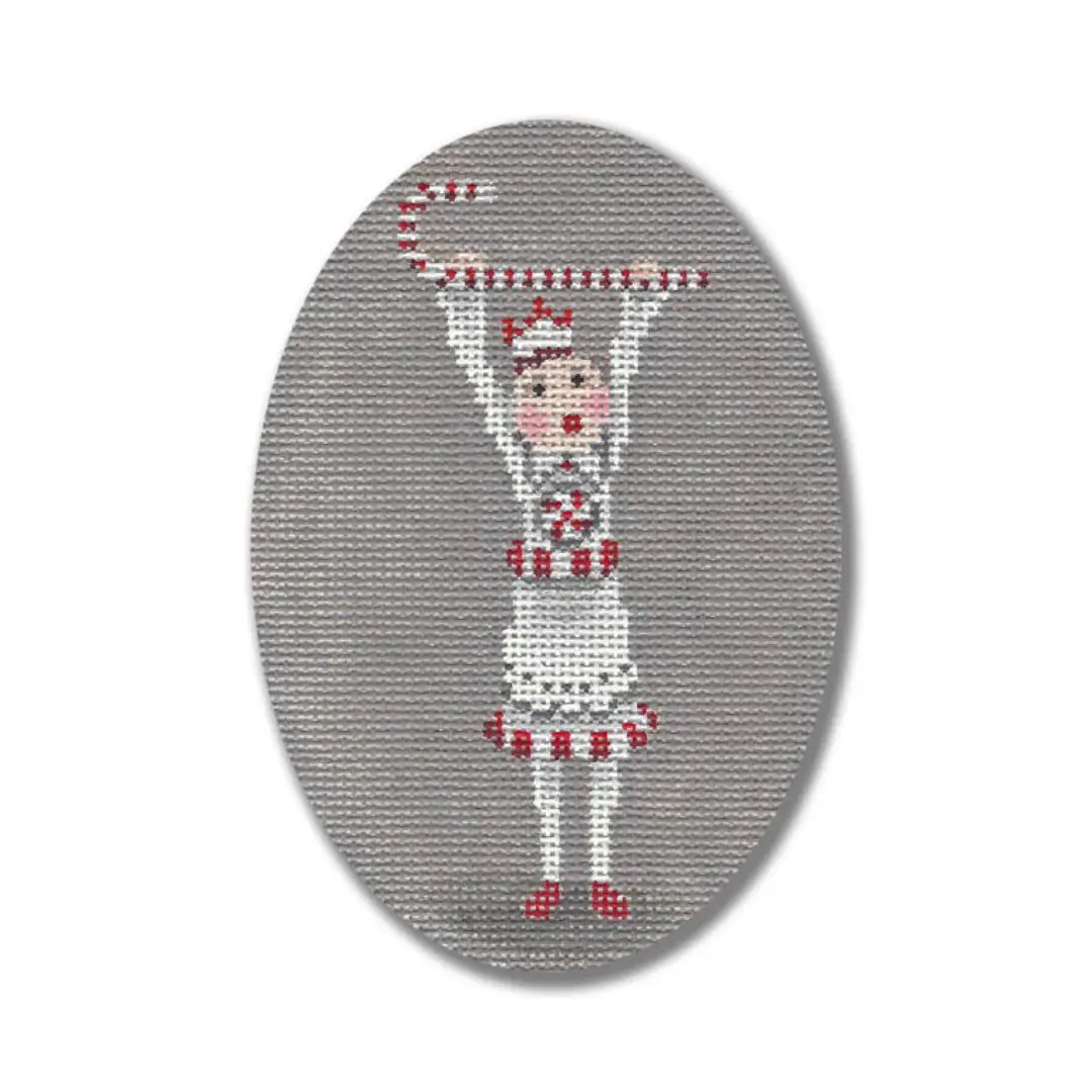 A Ciao Bella Collection cross stitch picture of a girl holding a candy cane.