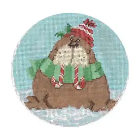 A cross stitch picture of a beaver wearing a hat and scarf.