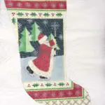 A christmas stocking with santa claus on it.